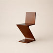 Wooden chair with a unique zigzag design on a beige background