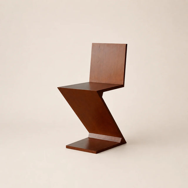 Wooden chair with a unique zigzag design on a beige background