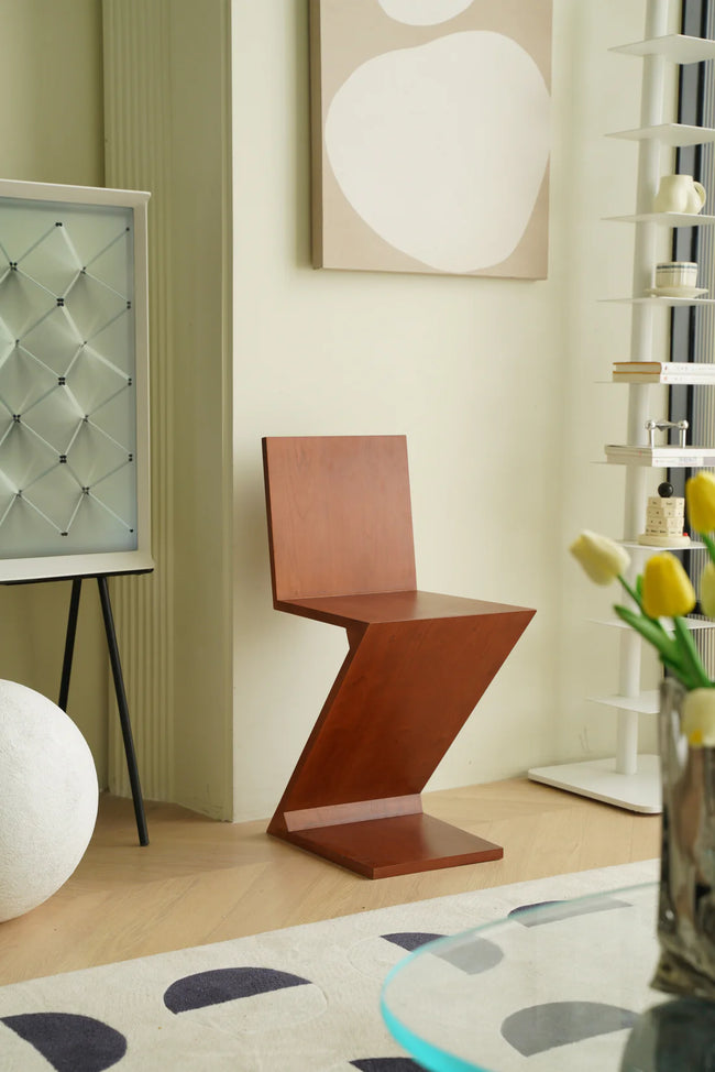 Modern room interior with a unique bar chair, abstract art, and decorative elements.