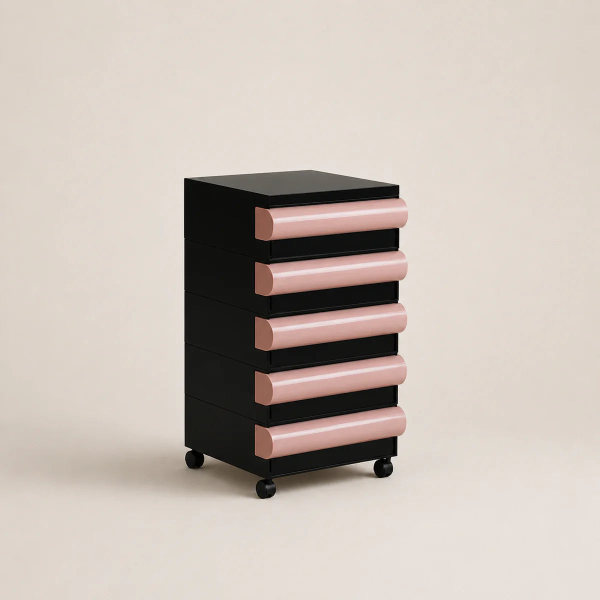 Black and pink drawer unit on wheels against a beige background