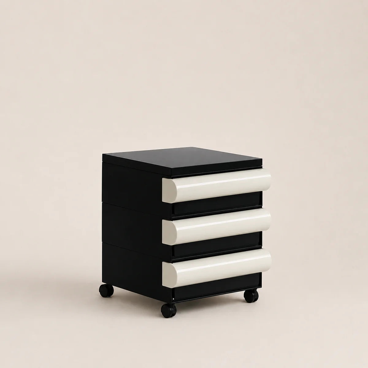 Black and white drawer unit on wheels against a beige background