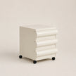 White ribbed nightstand on a beige background