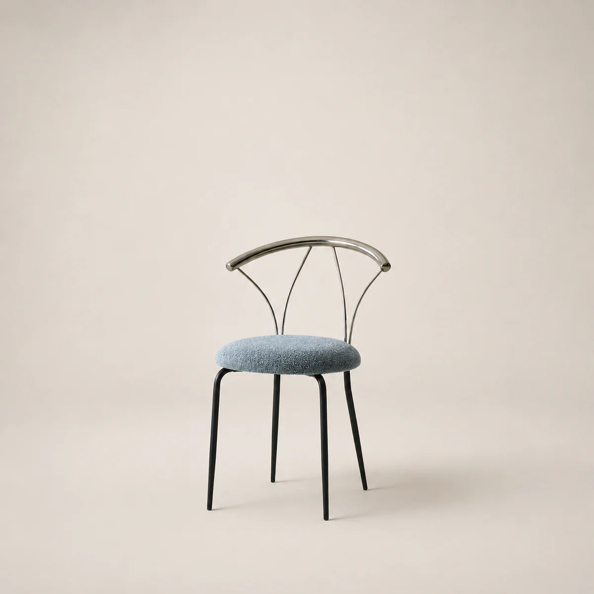 Chair with black metal frame and blue cushion on a beige background