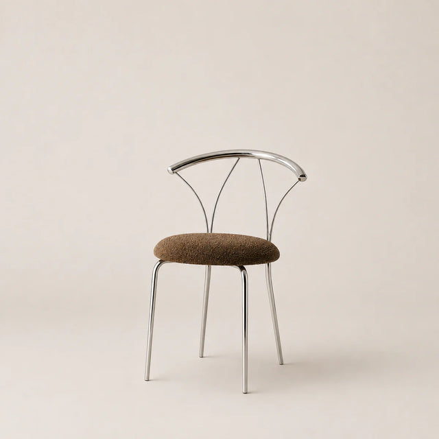 Modern chair with metal frame and brown cushion on a beige background