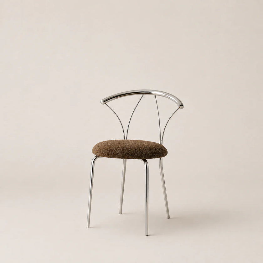 Modern chair with metal frame and brown cushion on a beige background