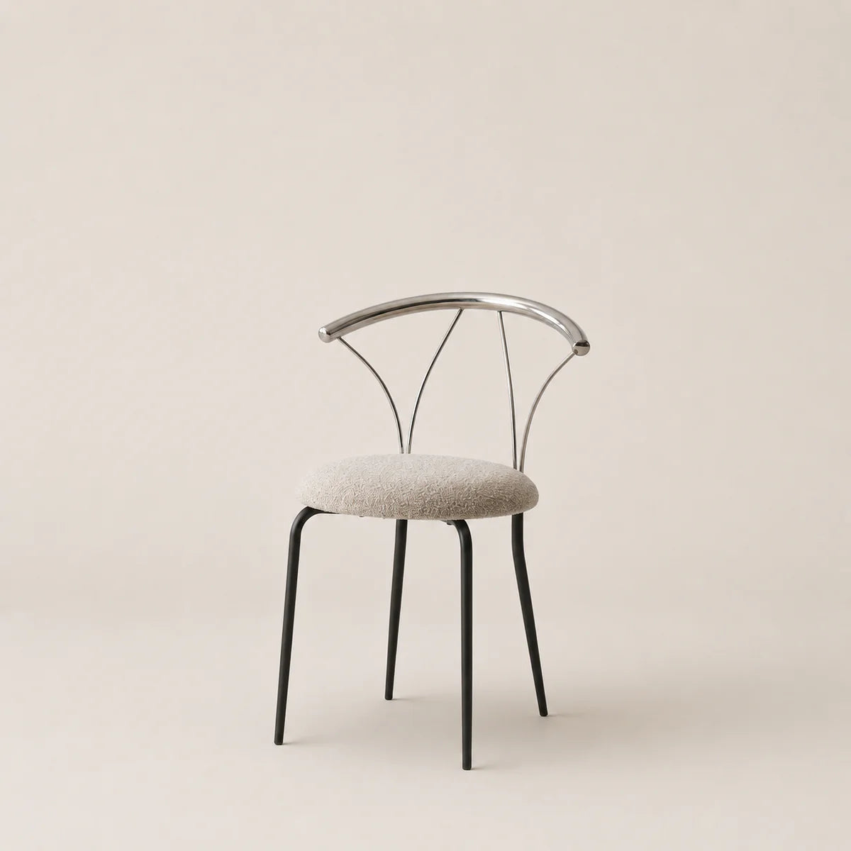 Modern chair with metal frame and upholstered seat on a beige background