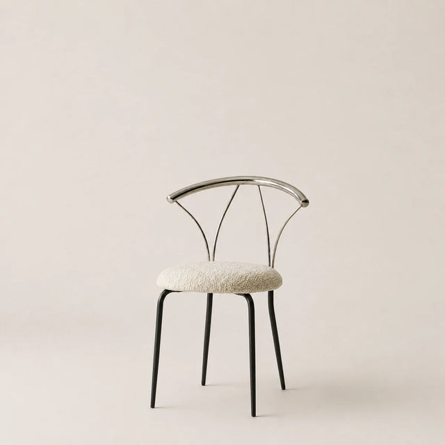 Modern chair with a white cushioned seat on a beige background