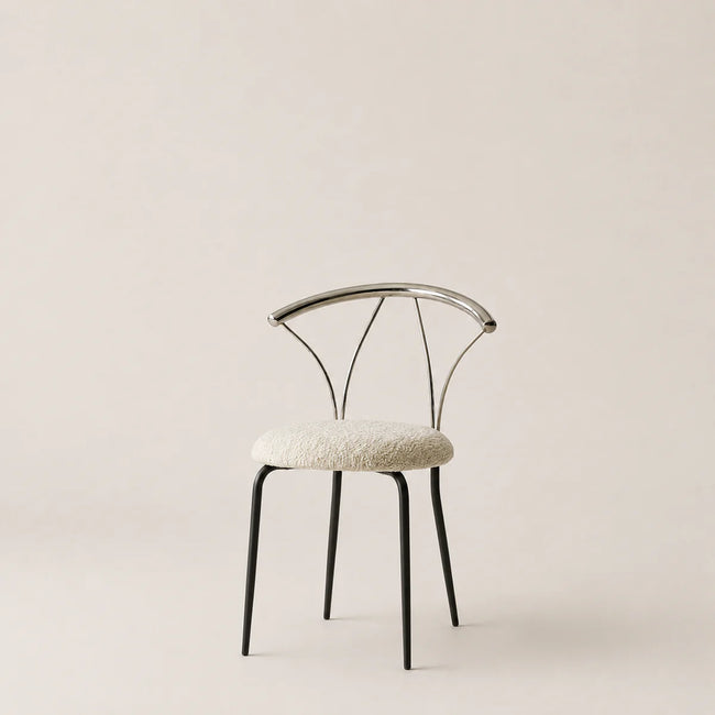 Modern chair with a white cushioned seat on a beige background