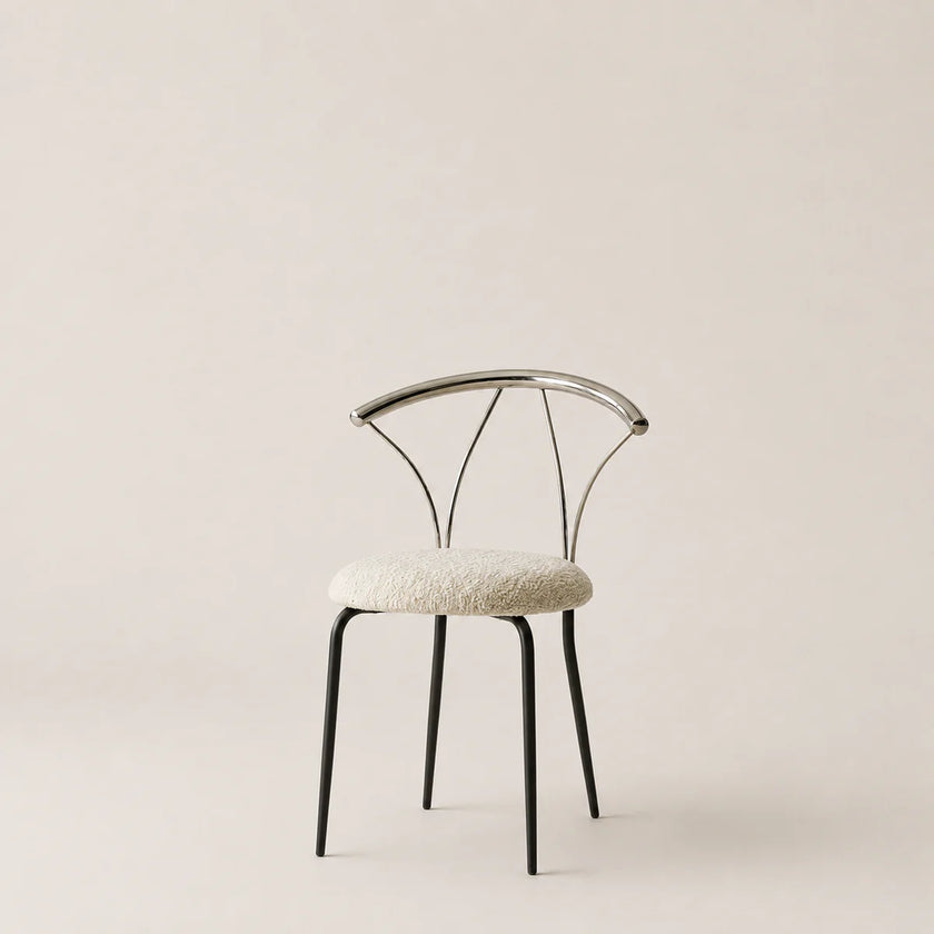 Modern chair with a white cushioned seat on a beige background