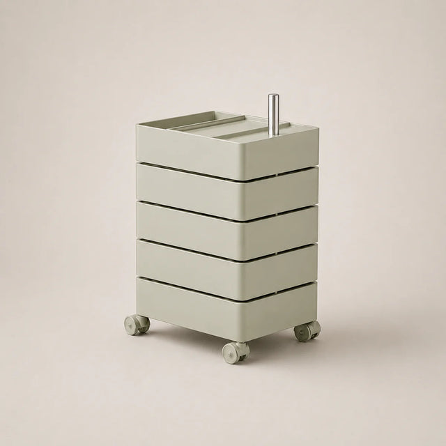 Matcha green rolling storage unit with drawers on wheels against a beige background