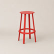 Red bar stool on a beige background