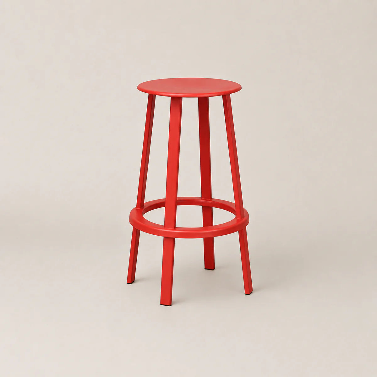 Red bar stool on a beige background