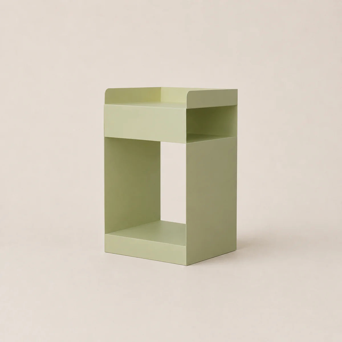 Green side table on a beige background