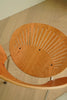 Wooden chair with a unique design on a wooden floor