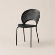 Black chair with modern design on a beige background