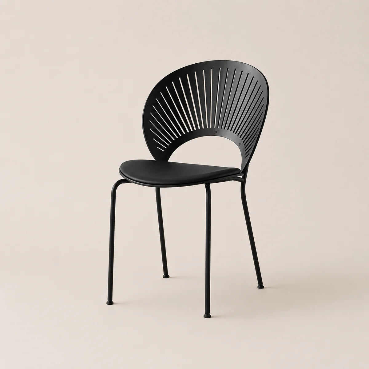 Black chair with modern design on a beige background