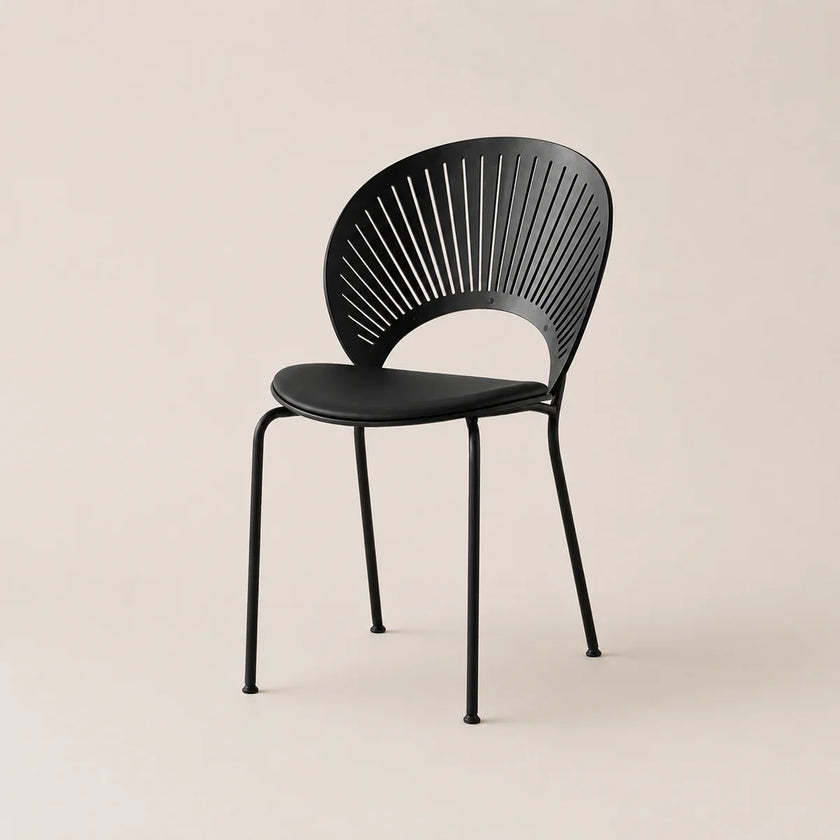 Black chair with modern design on a beige background
