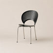 Black chair with modern design on a beige background