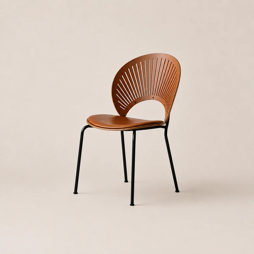 Wooden chair with black metal legs on a beige background