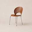 Wooden chair with metal legs on a beige background