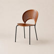 Wooden chair with black metal legs on a beige background