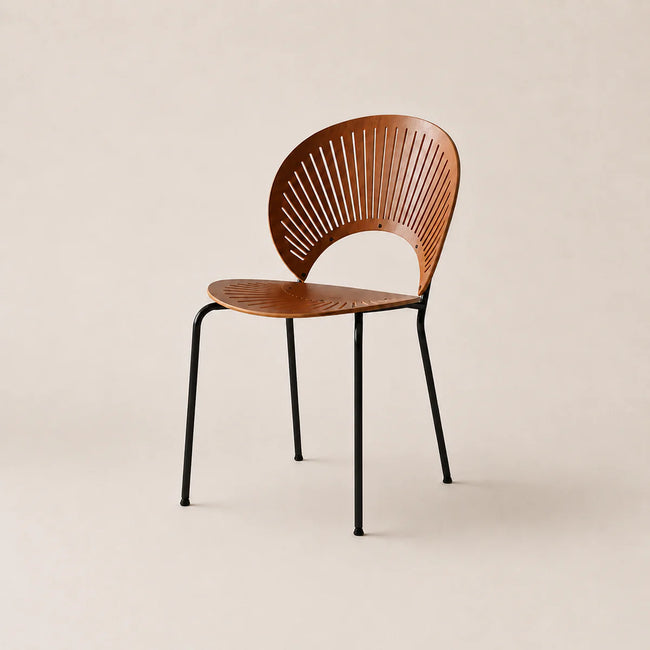 Wooden chair with black metal legs on a beige background