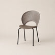 Modern chair with a unique back design on a beige background