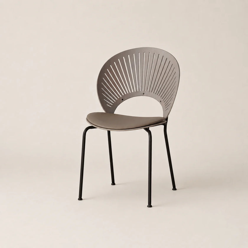 Modern chair with a unique back design on a beige background