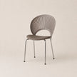 Modern chair with a minimalist design on a beige background