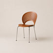 Wooden chair with metal legs on a beige background