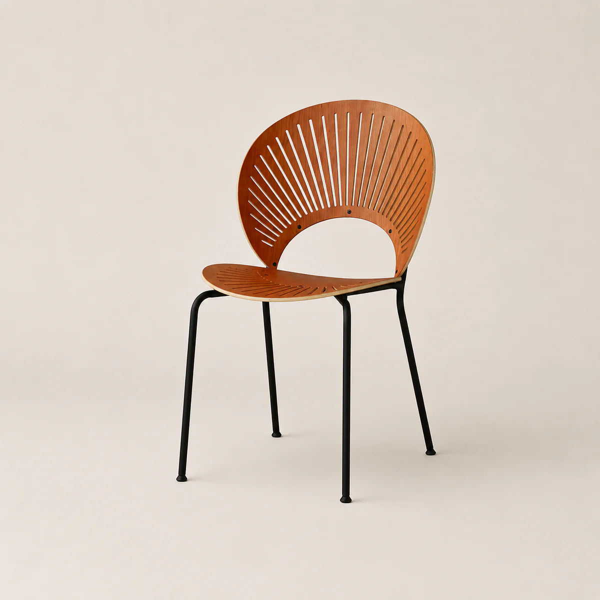 Wooden chair with black metal legs on a beige background