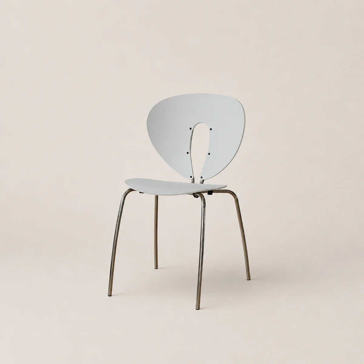 Modern chair with a light blue backrest and seat on a beige background