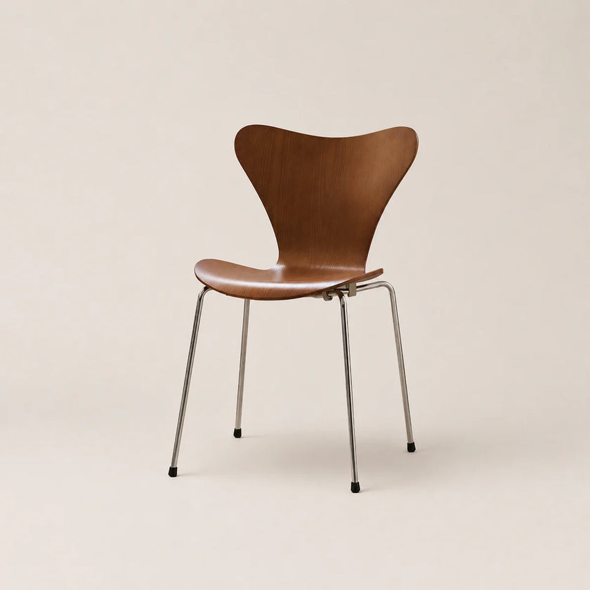 Brown chair with metal legs on a beige background