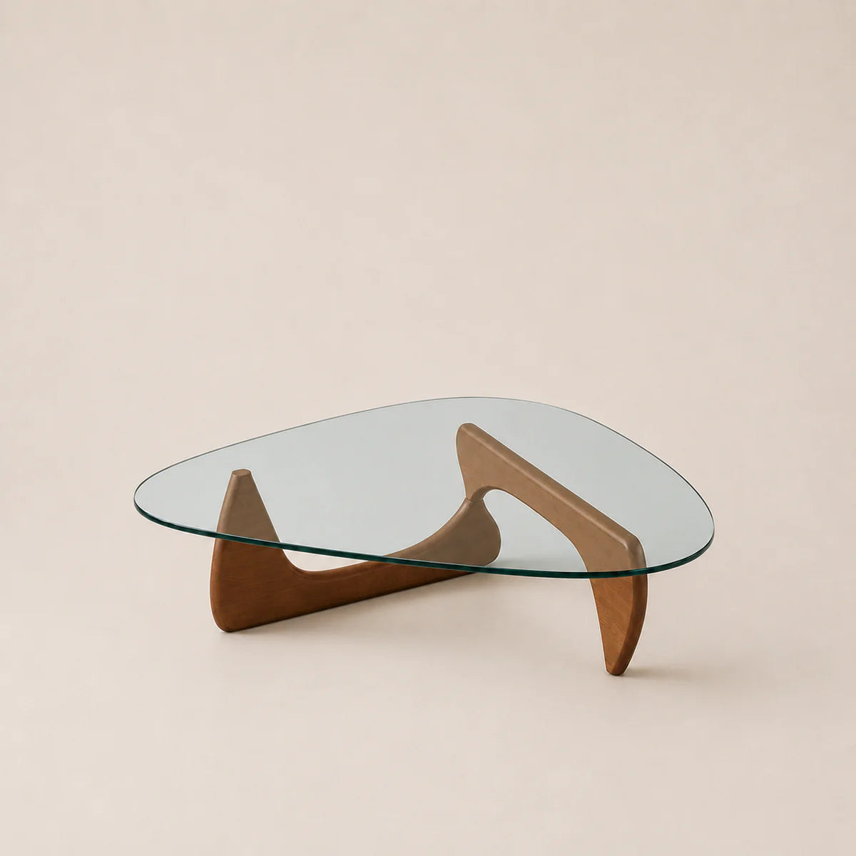 Glass coffee table with wooden base on a beige background