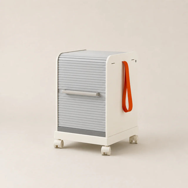 Modern rolling cart with a gray door and orange handle on a beige background