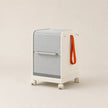Modern rolling cart with a gray door and orange handle on a beige background