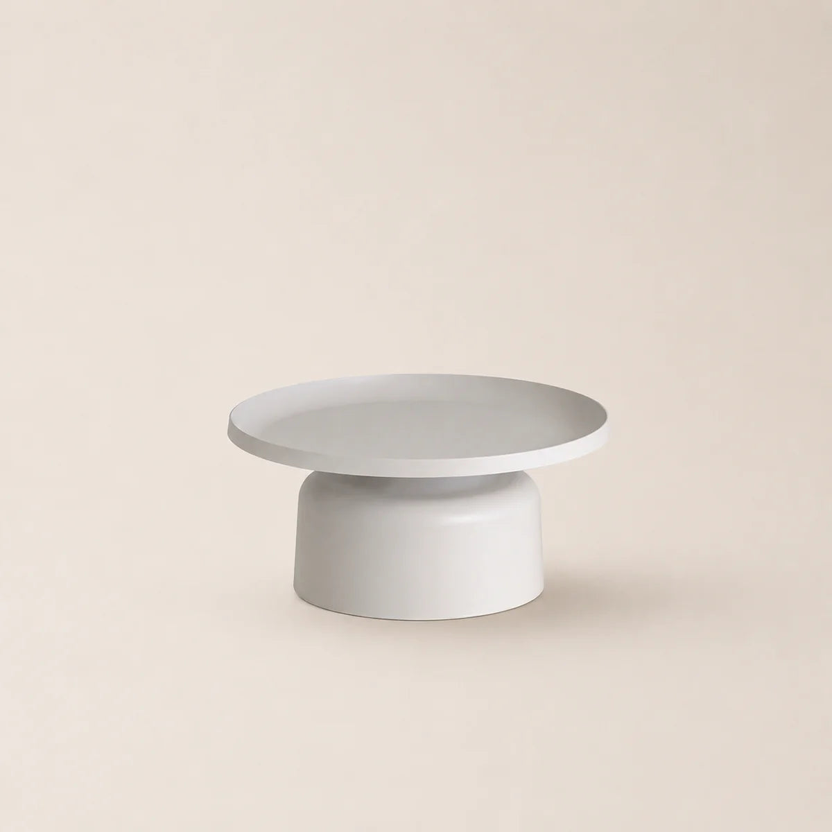 Two-tiered white table on a beige background