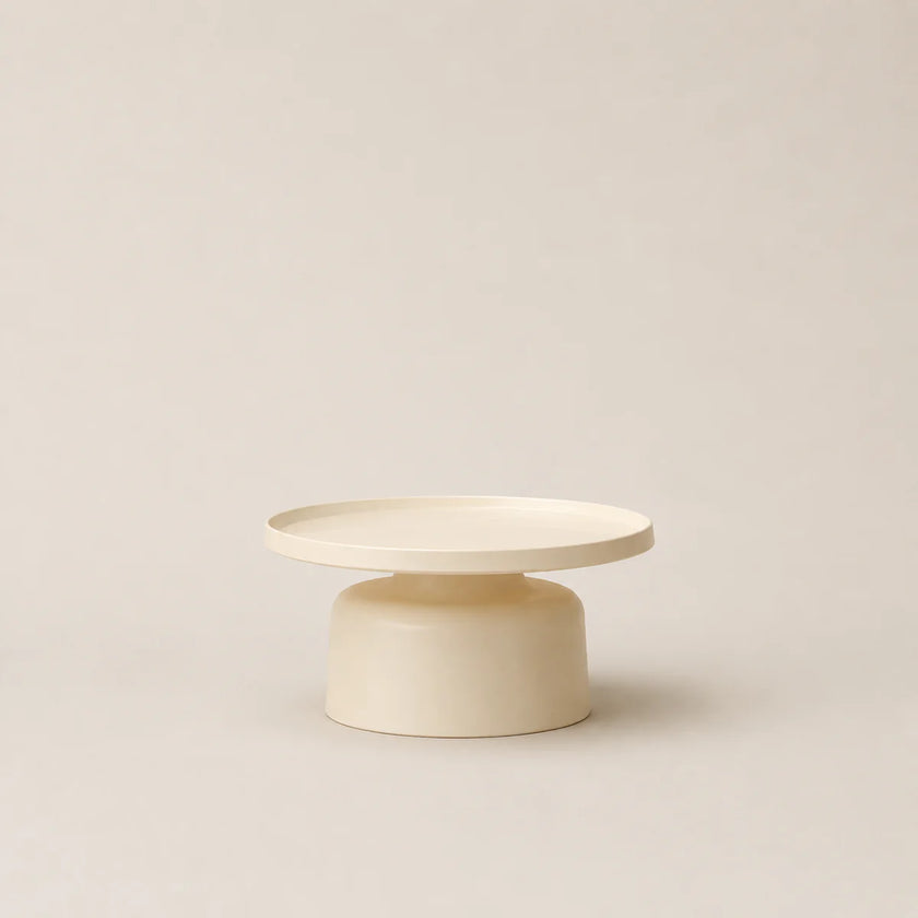 Minimalist ceramic table with two levels on a beige background