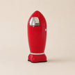 Red vintage-style trash can on a beige background