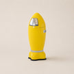 Yellow foot-shaped bin with a reflective band on a beige background