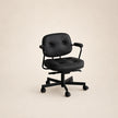 Black office chair on a beige background