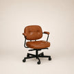 Brown leather office chair on a beige background