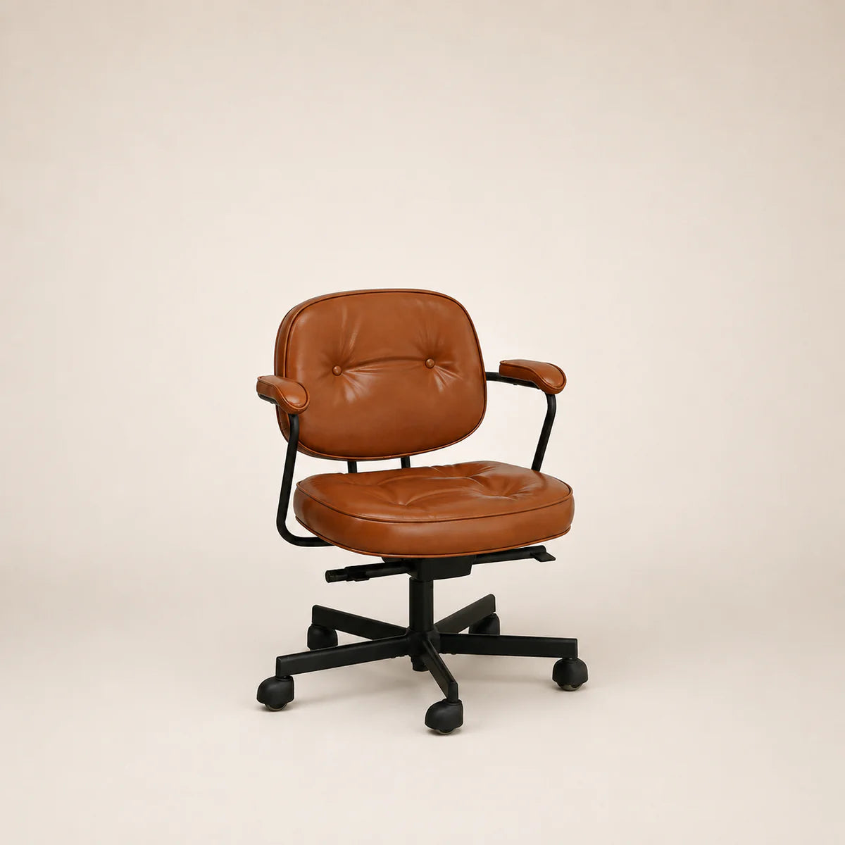 Brown leather office chair on a beige background
