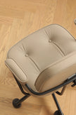 Beige office swivel arm chair cushion on a wooden floor