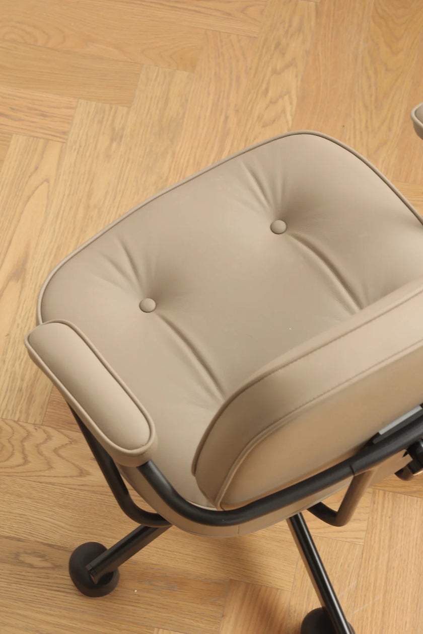 Beige office swivel arm chair cushion on a wooden floor
