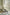 Beige office arm chair in a room with a abstract painting on the wall