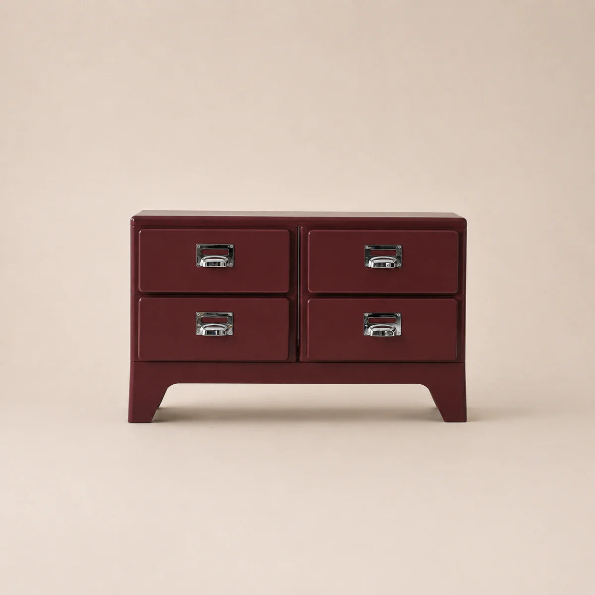 Red dresser with four drawers on a beige background