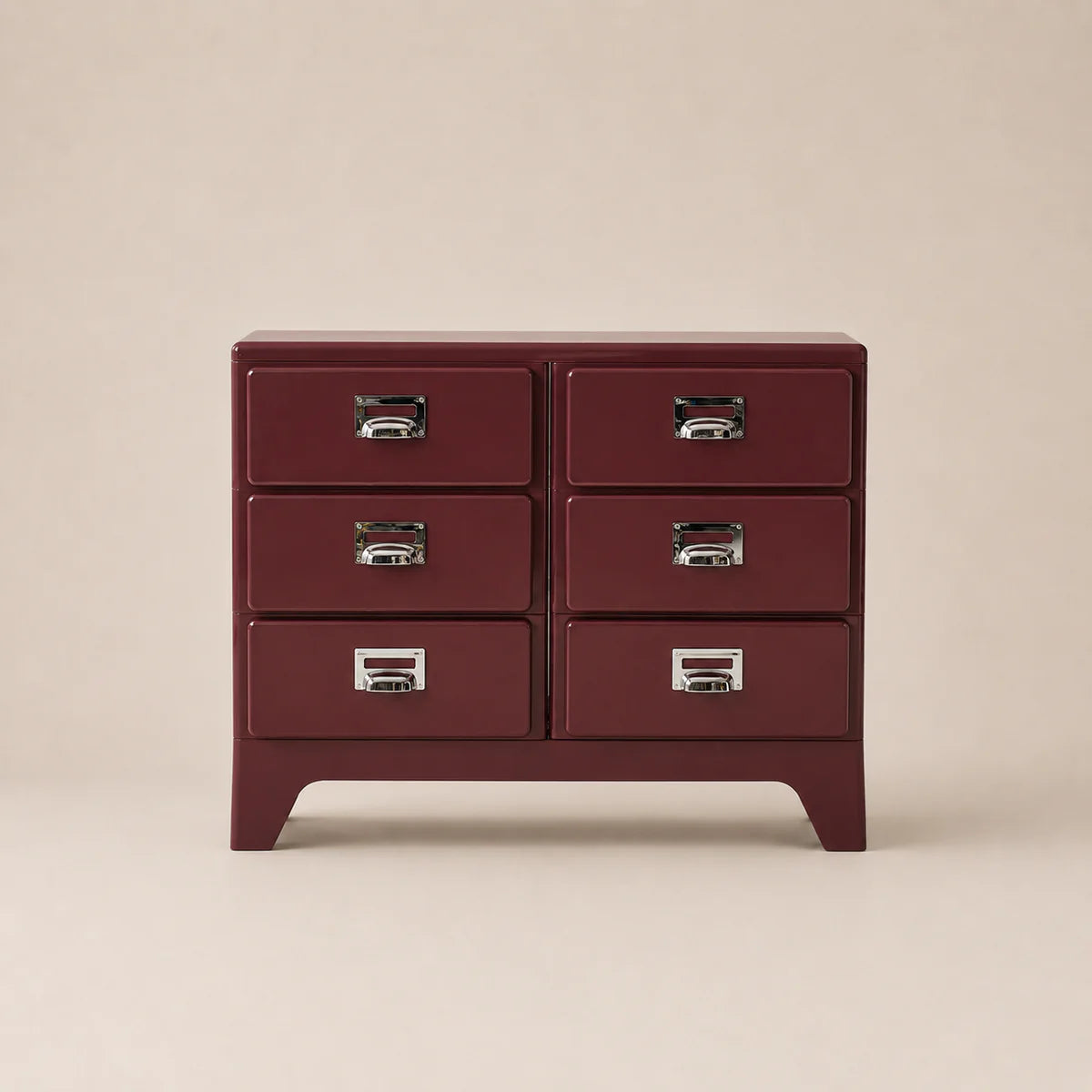 Red dresser with silver handles on a beige background