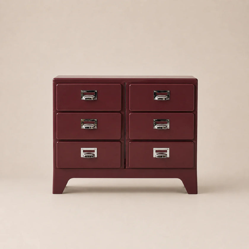 Red dresser with silver handles on a beige background