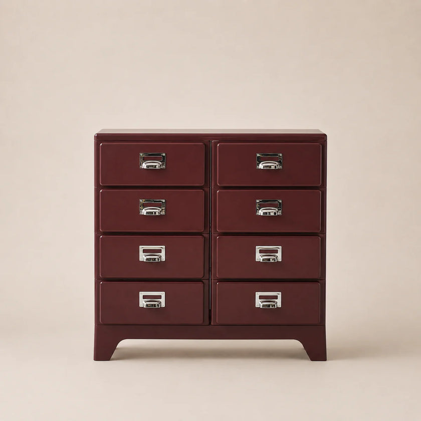 Red dresser with six drawers on a beige background